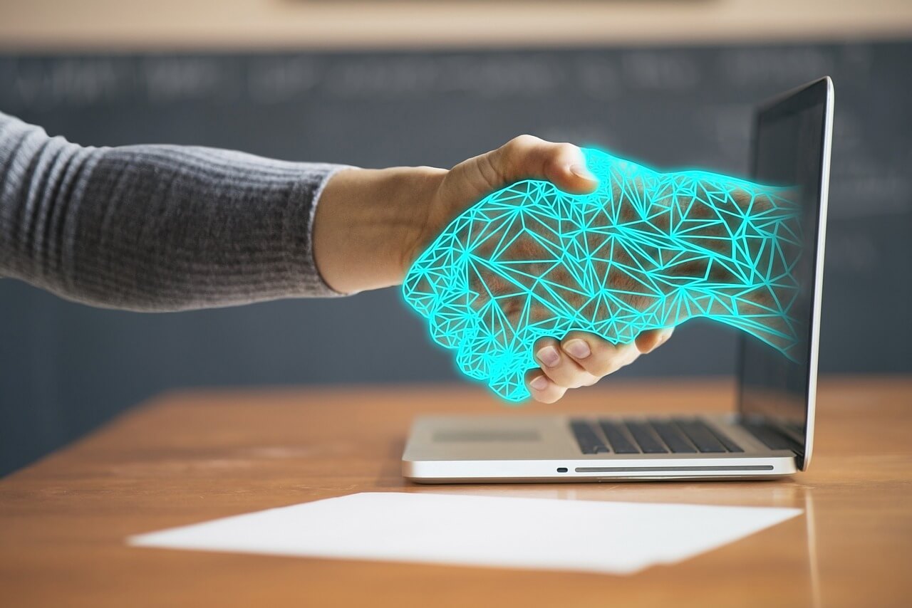 Futuristic handshake representing business and AI collaboration